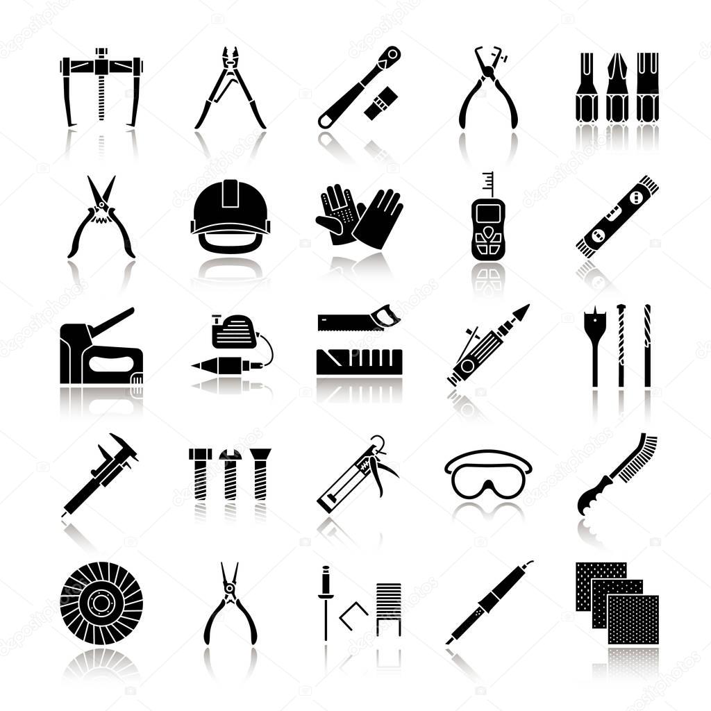Construction tools drop shadow black glyph icons set. Renovation and repair instruments. Emery paper, solderer, ratchet, bearing puller, spirit level. Isolated vector illustrations