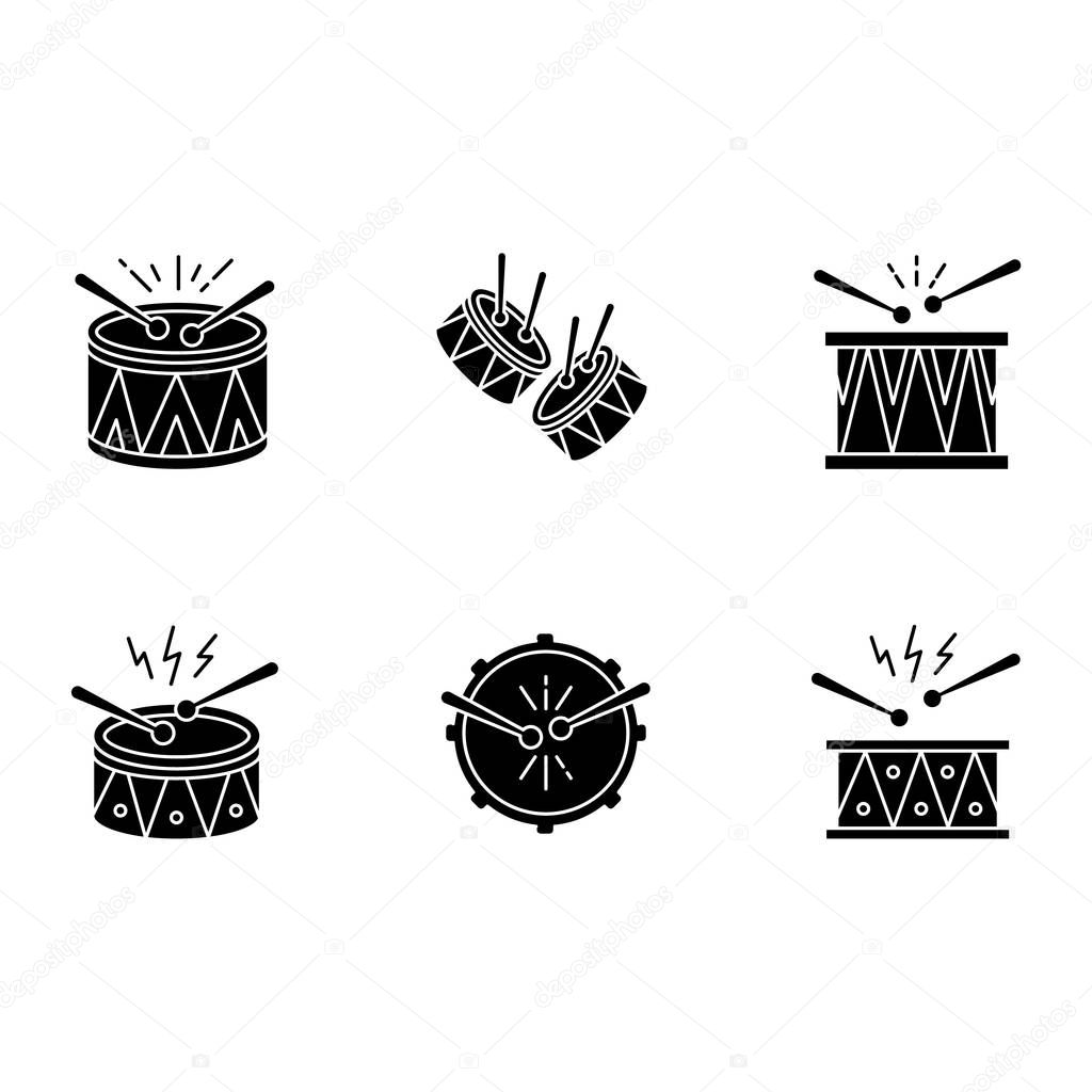 Brazilian music black glyph icons set on white space. Drums with drumsticks. Samba. Musical instrument. Brazilian carnival. Festive drum parade. Silhouette symbols. Vector isolated illustration
