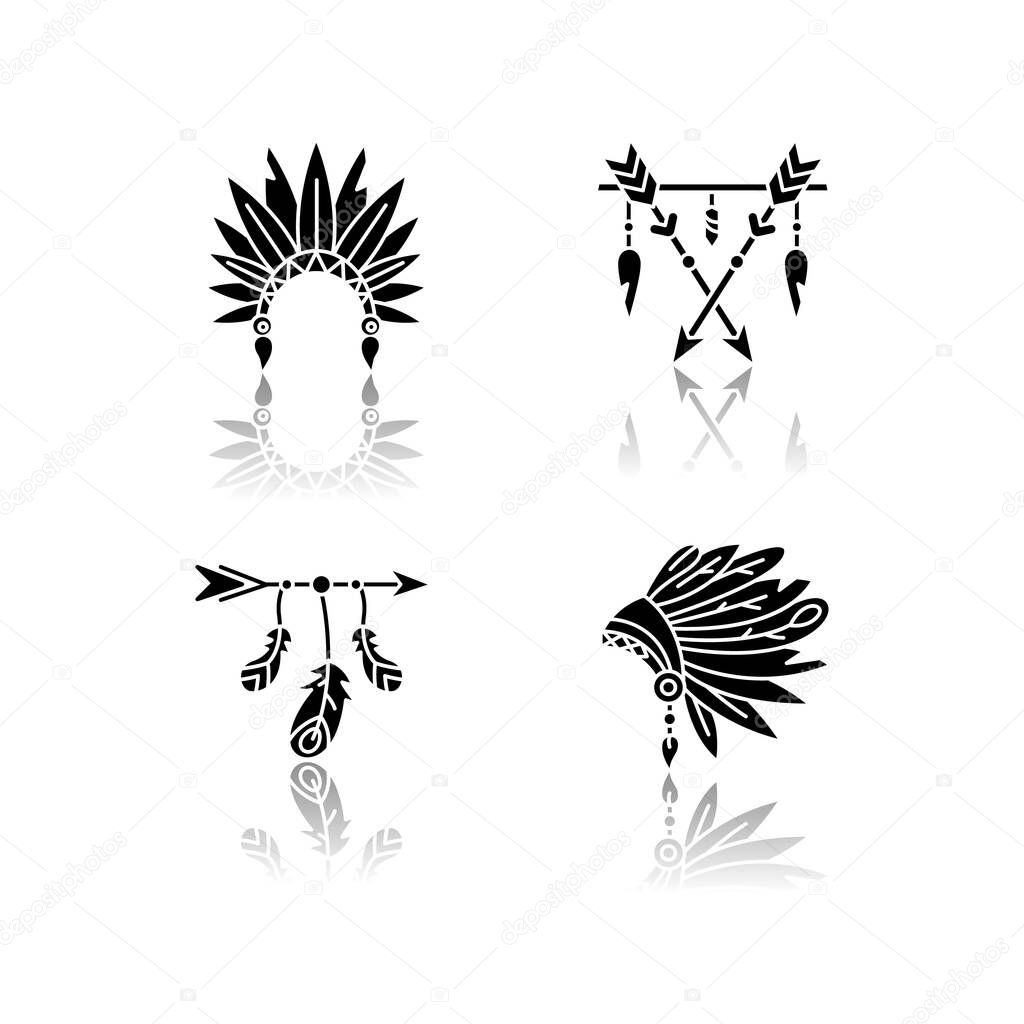 Native american indian hat and amulet drop shadow black glyph icons set. Tribe chief headdress with feathers. Boho style charm. Ethnic accessories. Isolated vector illustrations on white space