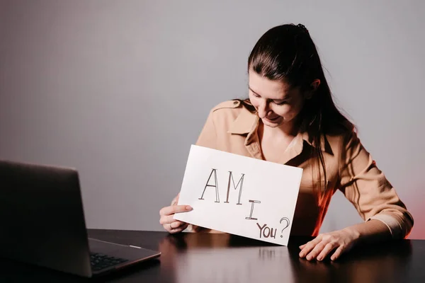 The girl teaching English and shows phrases using signs at. Innovative pedagogy to teaching in online school.A new english course is available online.