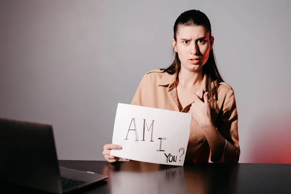 The girl teaching English and shows phrases using signs at. Innovative pedagogy to teaching in online school.A new english course is available online.