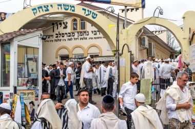 Uman, Ukraine - 21 September 2017: Rosh Hashanah, Jewish New Year 5778. It is celebrated near the grave of Rabbi Nachman in Uman. Pilgrims at the entrance to the synagogue. clipart