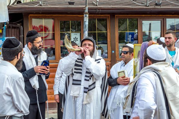 Uman, Ukraine - 21 September 2017: Rosh Hashanah, Jewish New Year 5778. It is celebrated near the grave of Rabbi Nachman in Uman. Jewish hasid blows Shofar.