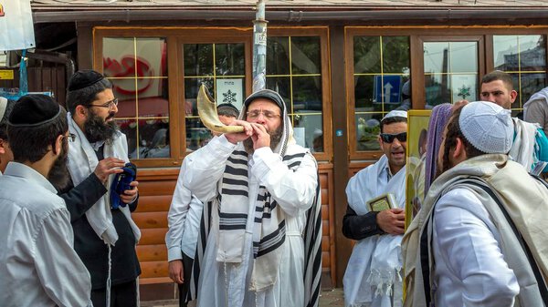 Uman, Ukraine - 21 September 2017: Rosh Hashanah, Jewish New Year 5778. It is celebrated near the grave of Rabbi Nachman in Uman. Jewish hasid blows Shofar.