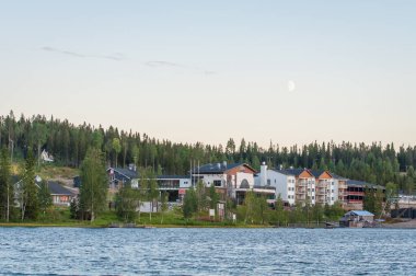 Finland - August 19, 2018. Ukkohalla Ski Resort is located in Central Finland, the Kainuu region. The most environmentally friendly air. A lake in the middle of a forest. Cozy picturesque cottages.
