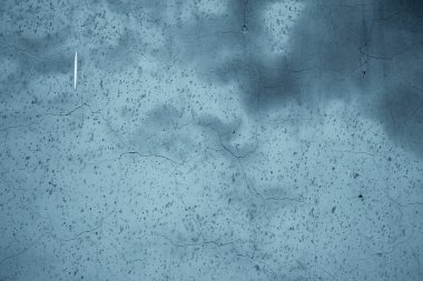 Alçılı duvarın pürüzlü dokusu - mavi grunge arkaplan