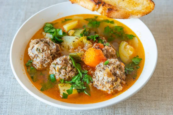 Mexican soup with meatballs and vegetables in a plate on a rustic background - Albondigas — Stock Image Mexican Soup Meatballs Vegetables Plate Rustic Background Albondigas Royalty Free Stock Photos