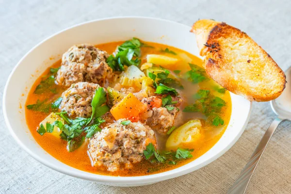 Mexican soup with meatballs and vegetables in a plate on a rustic background - Albondigas — Stock Image Mexican Soup Meatballs Vegetables Plate Rustic Background Albondigas Royalty Free Stock Images