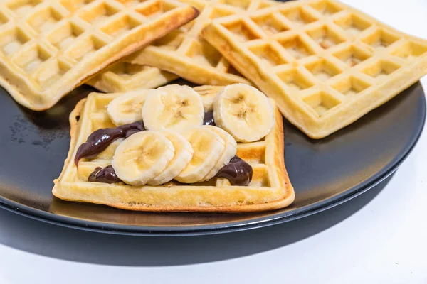 Belgian Homemade Waffles Chocolate Sauce Bananas Black Plate — Stock Photo, Image