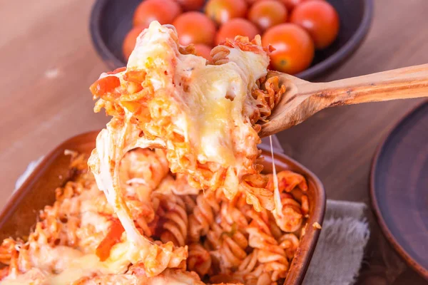 Female Hand Spooning Fusilli Paste Baked Mozzarella Tomato Pan Baking — Stock Photo, Image