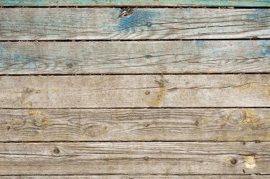 Yeşil boya kalıntıları olan eski tahtalar. Kırsal ahşap arka plan.