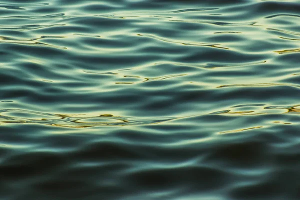Blurred texture of soft water with sunshine