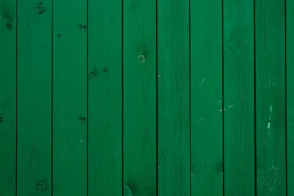 Green wooden board with knots - wooden background