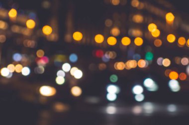 Gece şehrinin parlak ışıkları - güzel bulanık arka plan
