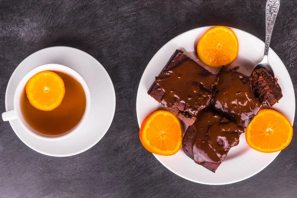 Pieces Chocolate Cake Poured Chocolate White Plate Cup Tea Lemon — Stock Photo, Image