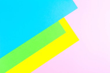 Malzeme tasarımına sarı, mavi, pembe ve yeşil arka plan kağıt. Fotoğraf.