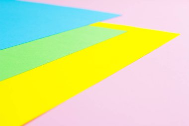Malzeme tasarımına sarı, mavi, pembe ve yeşil arka plan kağıt. Fotoğraf.