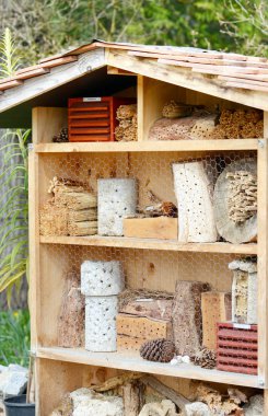 Insect hotel for wild solitary bees and other insects clipart