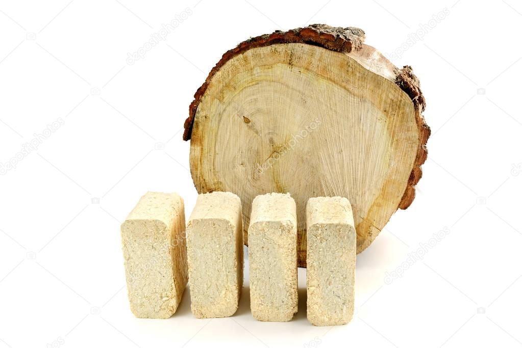 wood briquettes and oak tree trunk on white isolated background