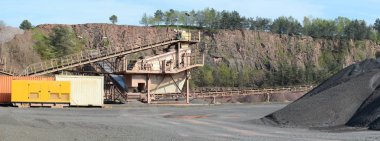 stone crusher in a quarry mine of porphyry rock. clipart