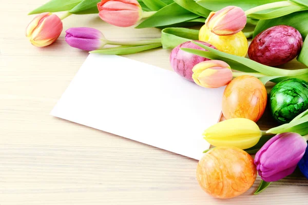 Easter eggs and tulips with copy space — Stock Photo, Image