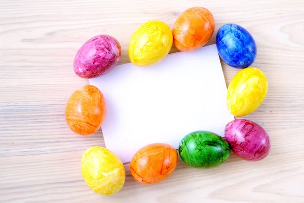 Easter eggs with paper copy space — Stock Photo, Image