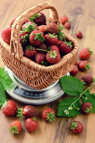 Basket of Strawberries on wooden table background — Stock Photo, Image