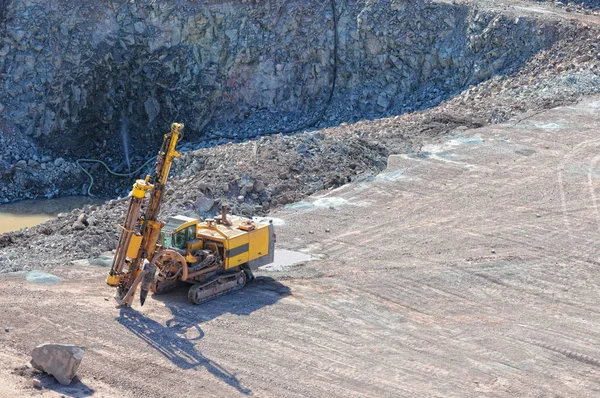 Driller in a quarry mine. exploring rock material. porphyry rock — Stock Photo, Image