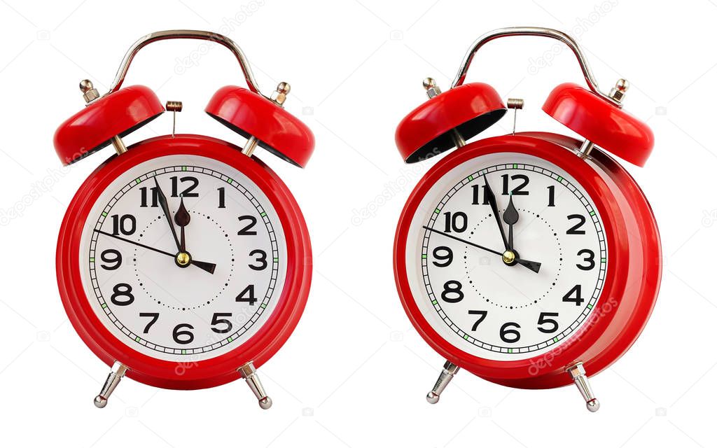 Red retro alarm clock at twelve o'clock, isolate.