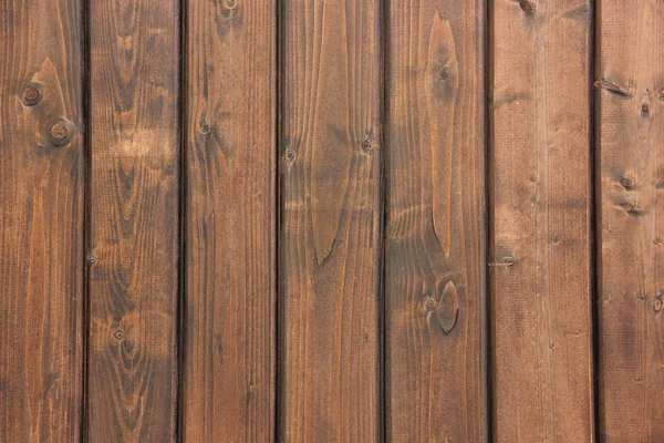 Wall from the boards covered with dark varnish. — Stock Photo, Image