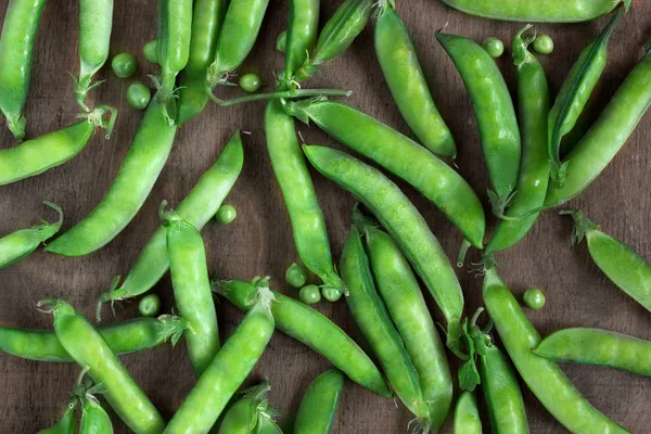 Pea pods on the table, top view. — Stock Photo, Image