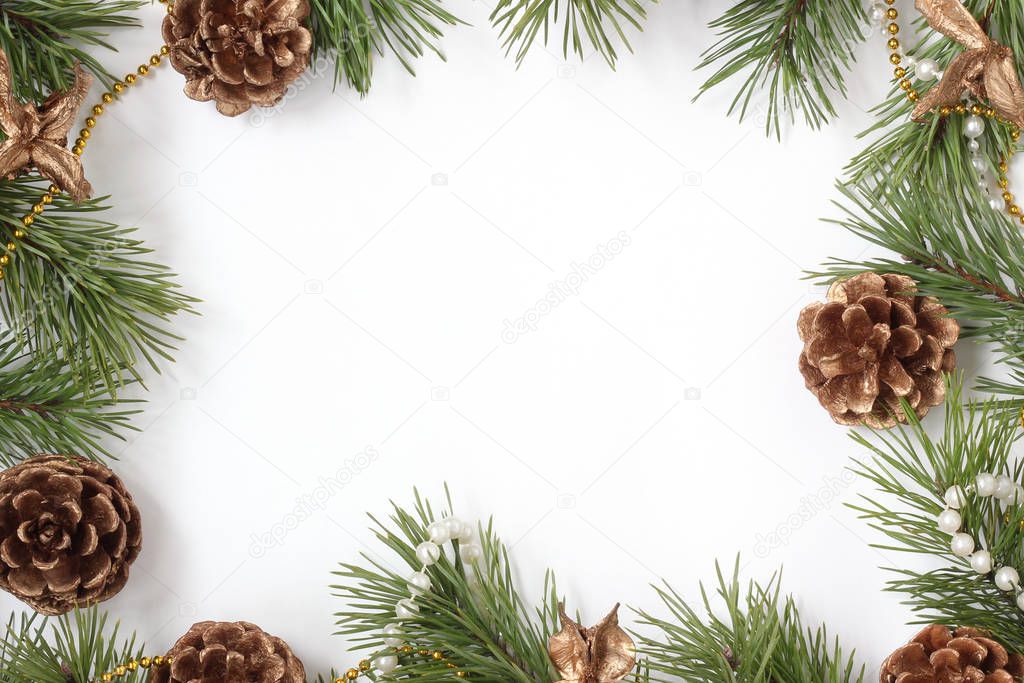 Christmas card with pine branches, Golden cones and beads