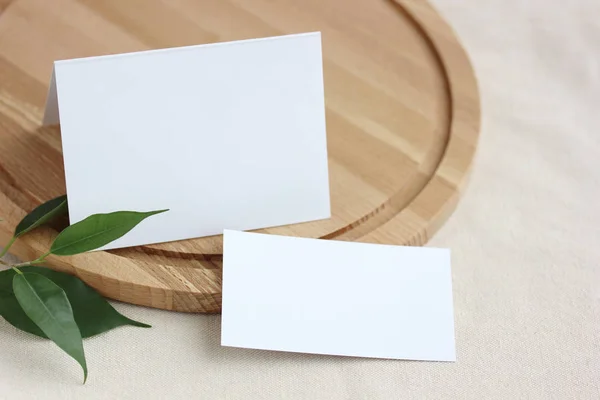 blank white paper card and business card for your text or image. mockup, template, layout with space for copying. light background, selective focus.