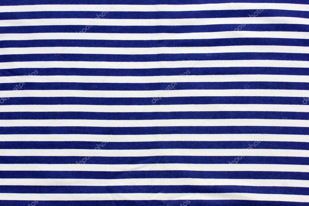 striped background, blue and white diagonal stripes. vest, marine backdrop. texture of the material.