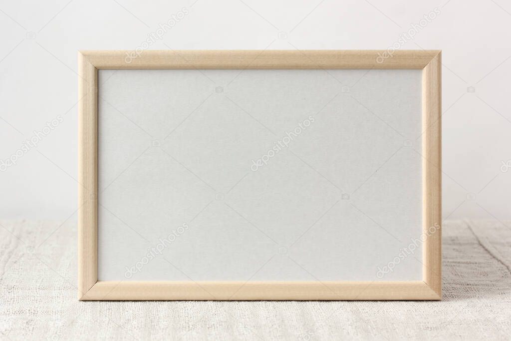 empty wooden frame with space for copying. light background, layout, mockup. place for editing your text or image.