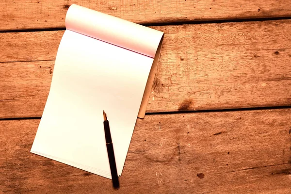 Blank notepad on old table — Stock Photo, Image