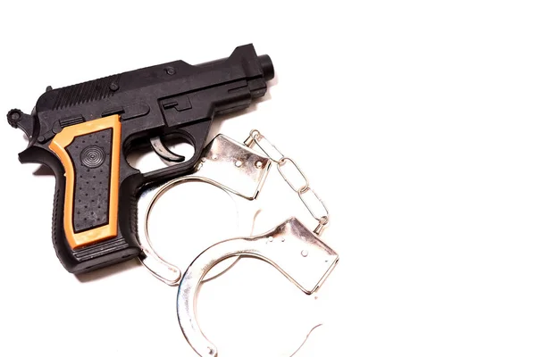 Hand lock-up en pistool — Stockfoto