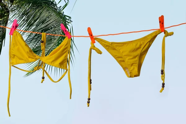 Bikini hanging on rope Royalty Free Stock Images