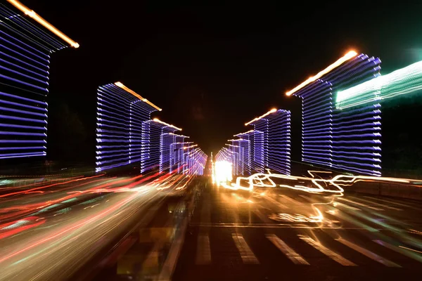 Abstract car trail on road. Abstract image of night traffic light on street.