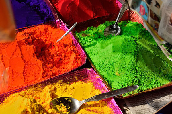 Colorful piles of powdered shopping for Holi festival 