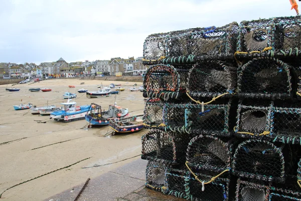 Lobster pots stacked on a quayside — ストック写真