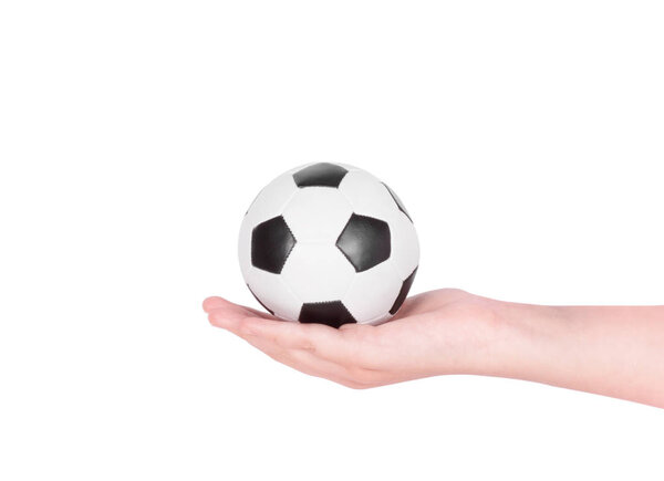 Soccer ball on hand isolated on white background