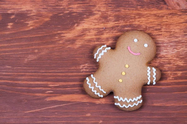 Gingerbread on wood desk — Stock Photo, Image