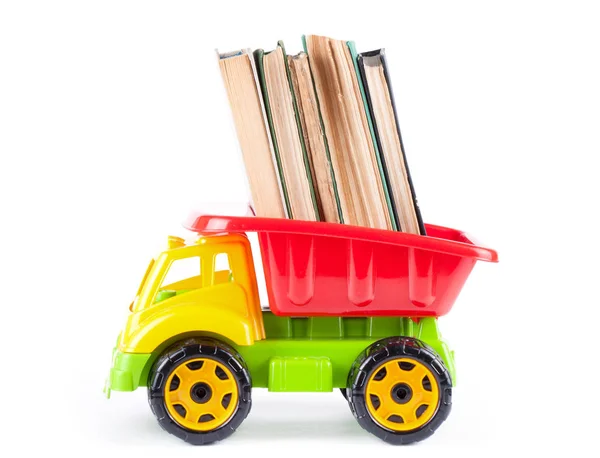 Caminhão de crianças com livros de pilha — Fotografia de Stock
