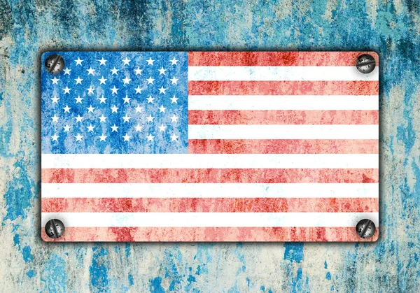 American flag on metal plate screwed screws on wall — Stock Photo, Image