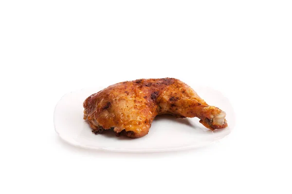 Φωτογραφία ψημένο μπούτι κοτόπουλο σε ένα πιάτο — Φωτογραφία Αρχείου