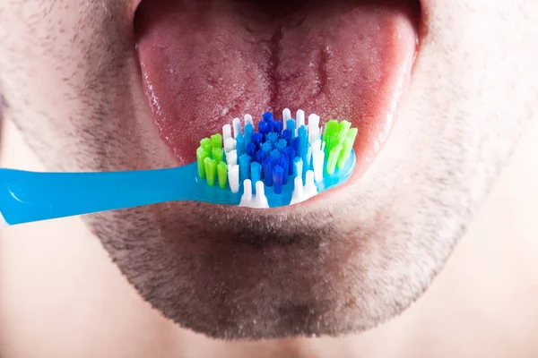 New tooth brush on the background of the person — Stock Photo, Image