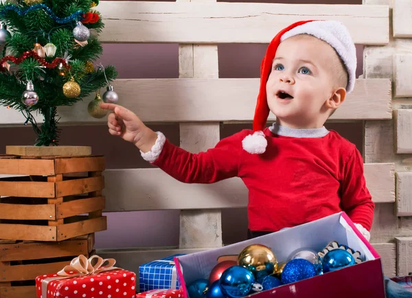 Children in Christmas clothes and santa hat. — Stock Photo, Image
