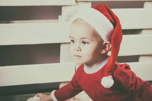 Children in Christmas clothes and santa hat. — Stock Photo, Image