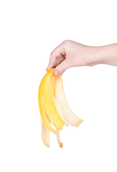 Banán bőr a kezében elszigetelt, a fehér háttér — Stock Fotó